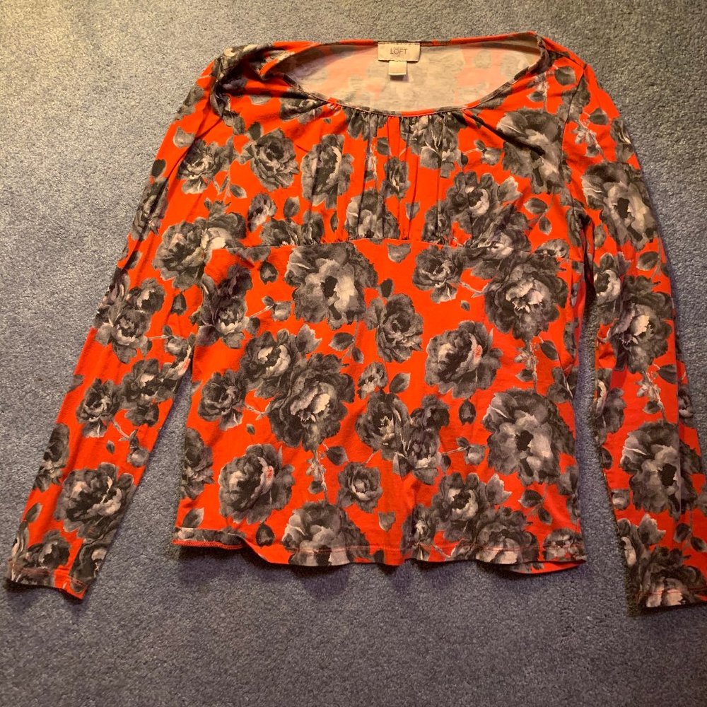Red empire waist top with gray flowers
